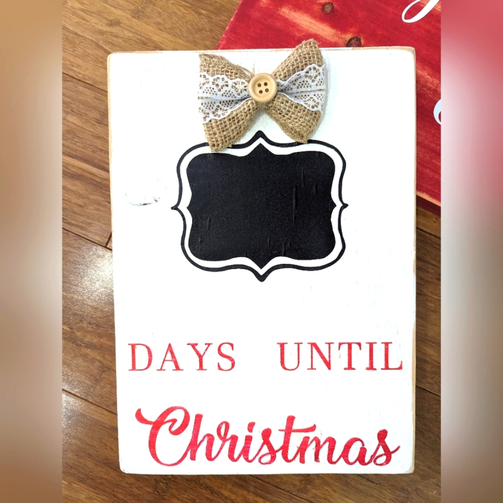 Christmas countdown chalk board on wood.